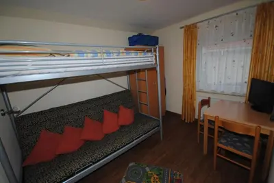 Ein Bett oder Betten in einem Zimmer der Unterkunft Ferienhaus Nordstern