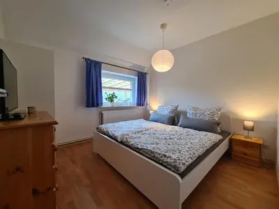 Ein Bett oder Betten in einem Zimmer der Unterkunft Ferienwohnung Sabrina