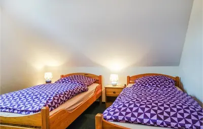 Ein Bett oder Betten in einem Zimmer der Unterkunft Gorgeous Apartment In Otterndorf