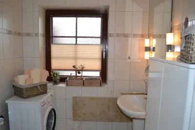 Ein Badezimmer in der Unterkunft Kernsaniertes Ferienhaus direkt hinterm Nordseedeich NW