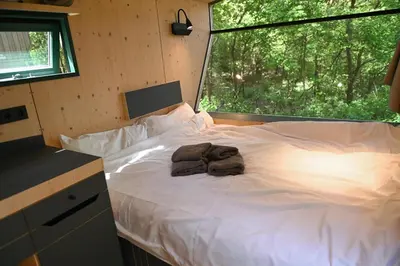 Ein Bett oder Betten in einem Zimmer der Unterkunft Sleep Space 1 - Green Tiny Spot Cuxhaven Wernerwald