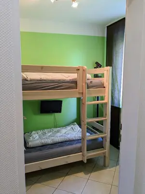 Ein Bett oder Betten in einem Zimmer der Unterkunft Haus Essen Whg. 8, lüttes Glück in Cuxhaven-Duhnen