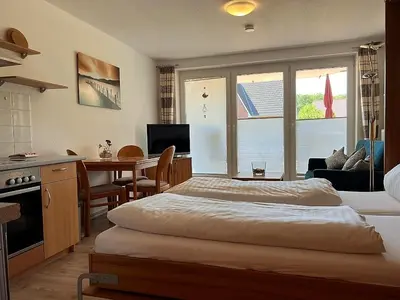 Ein Bett oder Betten in einem Zimmer der Unterkunft Haus am Mühlenpark Whg. 8