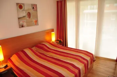 Ein Bett oder Betten in einem Zimmer der Unterkunft Strand-FeWo-Cuxhaven - Duhnen