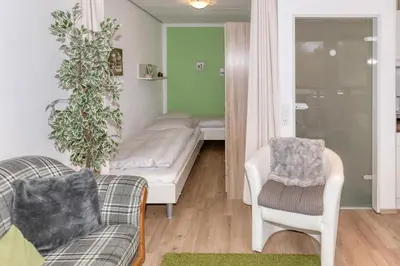 Ein Bett oder Betten in einem Zimmer der Unterkunft Terrassenhaus, FeWo 22