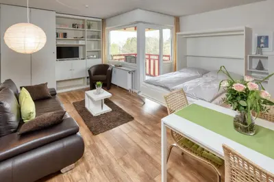 Ein Bett oder Betten in einem Zimmer der Unterkunft Terrassenhaus, FeWo 47
