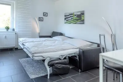 Ein Bett oder Betten in einem Zimmer der Unterkunft Terrassenhaus, FeWo 20