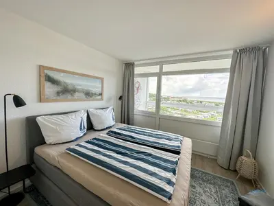 Ein Bett oder Betten in einem Zimmer der Unterkunft Haus Frische Brise Sahlenburg Wohnung 06 06 Seaside