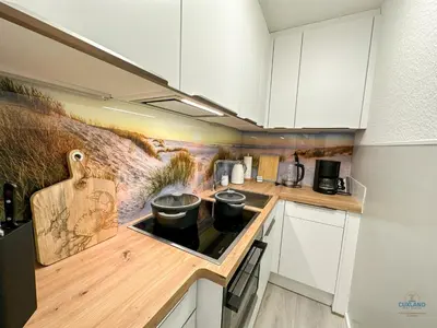 Küche/Küchenzeile in der Unterkunft Haus Frische Brise Sahlenburg Wohnung 06 06 Seaside