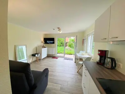 Ein Sitzbereich in der Unterkunft Am Oland 11 Bungalow