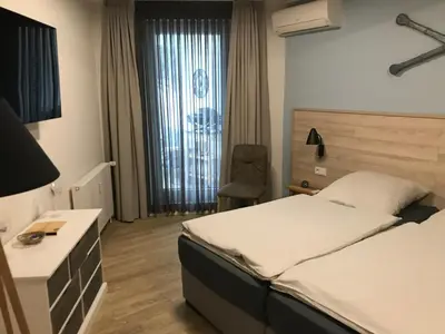 Ein Bett oder Betten in einem Zimmer der Unterkunft Haus Düne, Ferienwohnung 28
