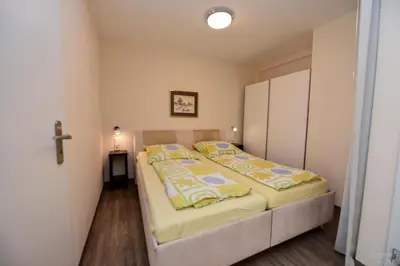 Ein Bett oder Betten in einem Zimmer der Unterkunft Haus Trafalger Appartement TR147