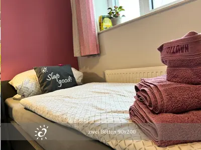 Ein Bett oder Betten in einem Zimmer der Unterkunft De Reetpieper