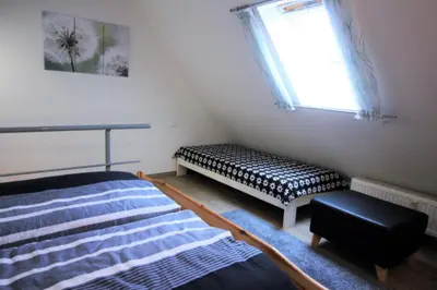 Ein Bett oder Betten in einem Zimmer der Unterkunft Kiebitzstieg 22, Whg 14