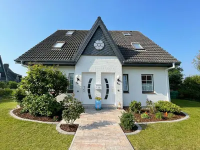 Ein Garten an der Unterkunft Bezaubernde Ferien-Doppelhaushälfte für Familien bis 4 Personen