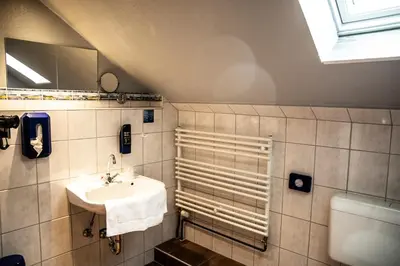 Ein Badezimmer in der Unterkunft Hotel Tum Stüürmann