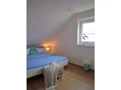 Ein Bett oder Betten in einem Zimmer der Unterkunft Ferienhaus Luv