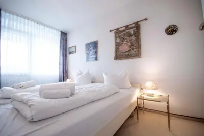 Ein Bett oder Betten in einem Zimmer der Unterkunft Frische Brise FeWo 12 01