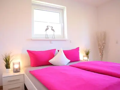 Ein Bett oder Betten in einem Zimmer der Unterkunft Ferienwohnung Wat Mutt