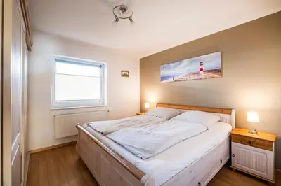 Ein Bett oder Betten in einem Zimmer der Unterkunft Haus Seewärts Wohnen Apartment 0 3
