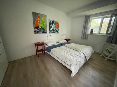 Ein Bett oder Betten in einem Zimmer der Unterkunft Appartment Hinterdeich