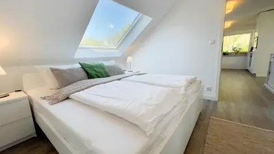 Ein Bett oder Betten in einem Zimmer der Unterkunft Kapitänshaus FeWo 3
