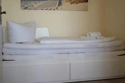 Ein Bett oder Betten in einem Zimmer der Unterkunft Frische Brise FeWo 15 09