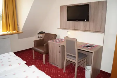 Ein Bett oder Betten in einem Zimmer der Unterkunft Hotel Neuses