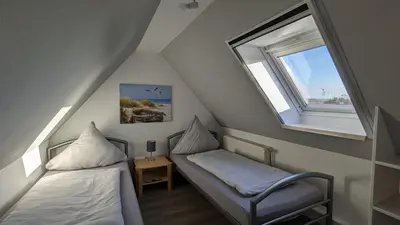 Ein Bett oder Betten in einem Zimmer der Unterkunft Dachgeschosswohnung Wilhelm