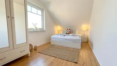 Ein Bett oder Betten in einem Zimmer der Unterkunft Haus Eversand Nr 2