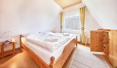 Ein Bett oder Betten in einem Zimmer der Unterkunft Haus Tide