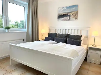 Ein Bett oder Betten in einem Zimmer der Unterkunft Haus am Waldbad FeWo 21