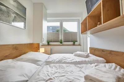 Ein Bett oder Betten in einem Zimmer der Unterkunft Meerauszeit
