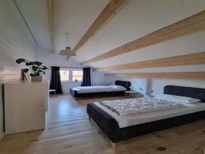 Ein Bett oder Betten in einem Zimmer der Unterkunft Comfort Steps from the North Sea