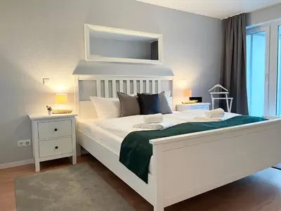 Ein Bett oder Betten in einem Zimmer der Unterkunft Haus Nordseebrandung FeWo C2 2