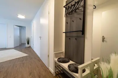Ein Bett oder Betten in einem Zimmer der Unterkunft Dorumer Sielhuus 5