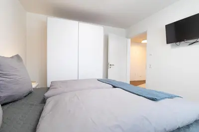 Ein Bett oder Betten in einem Zimmer der Unterkunft Dorumer Sielhuus 5