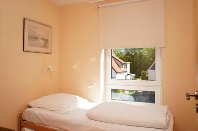 Ein Bett oder Betten in einem Zimmer der Unterkunft Kurpark Domizil Wohnung 2
