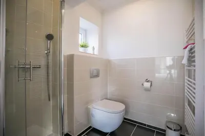 Ein Badezimmer in der Unterkunft Haus Wellen und Meer Apartment 1