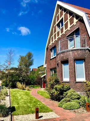 Ein Garten an der Unterkunft Haus Wellen und Meer Apartment 2
