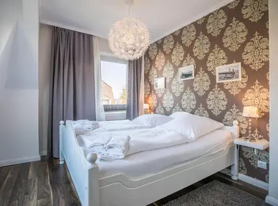 Ein Bett oder Betten in einem Zimmer der Unterkunft Haus Wellen und Meer Apartment 4