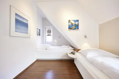 Ein Bett oder Betten in einem Zimmer der Unterkunft Residenz Seegras - 2