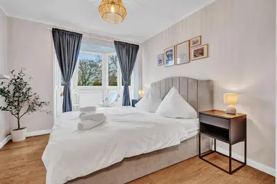 Ein Bett oder Betten in einem Zimmer der Unterkunft JAKSE-Apartments - Die entspannteste Wohnung an der Nordseeküste mit Sauna