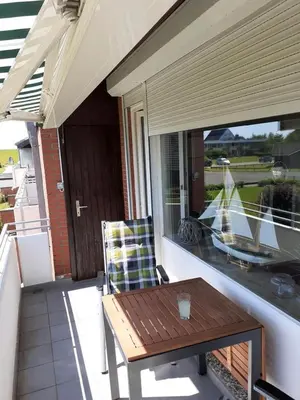 Ein Balkon oder eine Terrasse in der Unterkunft schöne Ferienwohnung in Friedrichskoog-Spitze