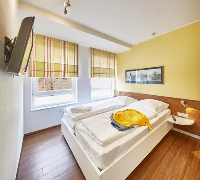 Ein Bett oder Betten in einem Zimmer der Unterkunft Residenz Seegras - 3