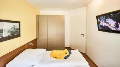 Ein Bett oder Betten in einem Zimmer der Unterkunft Residenz Seegras - 3