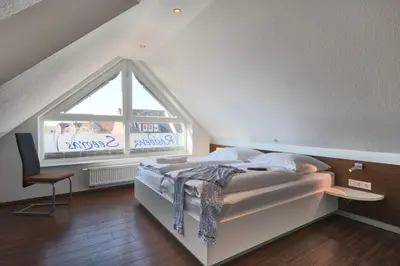 Ein Bett oder Betten in einem Zimmer der Unterkunft Residenz Seegras - 5