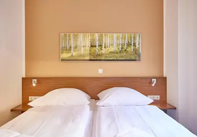 Ein Bett oder Betten in einem Zimmer der Unterkunft Residenz Seegras - 4