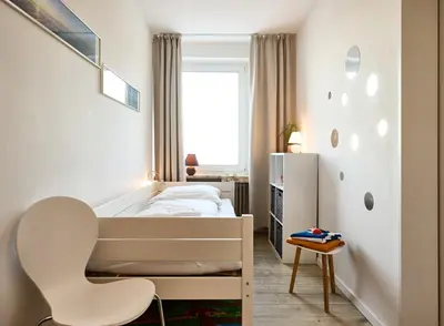 Ein Bett oder Betten in einem Zimmer der Unterkunft Rotesand - 128