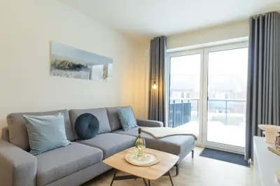 Ein Sitzbereich in der Unterkunft Ferienwohnung Hyggelig - Dorumer Sielhuus 15